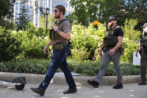 Law enforcement officer from Homeland Security Investigations (HSI) walking back to their vehicle after responding to a emergency call in Franklin Park in downtown Washington, Tuesday, Sept. 2, 2025, in Washington. (AP Photo/Pablo Martinez Monsivais)