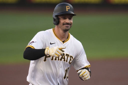 Pittsburgh Pirates' Bryan Reynolds celebrates as he rounds the bases after hitting a solo home run off Los Angeles Dodgers pitcher Emmet Sheehan during the first inning of a baseball game in Pittsburgh, Wednesday, Sept. 3, 2025. (AP Photo/Gene J. Puskar)