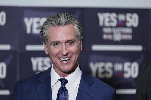 California Gov. Gavin Newsom answers questions after signing legislation calling for a special election on a redrawn congressional map on Thursday, Aug. 21, 2025, in Sacramento, Calif. (AP Photo/Godofredo A. Vásquez)