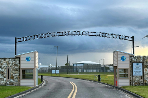 FILE - Clouds hover over the entrance of the Florida State Prison in Starke, Fla., Aug. 3, 2023. (AP Photo/Curt Anderson, file)
