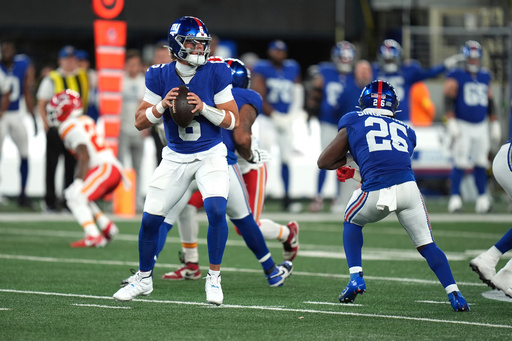 FILE - New York Giants quarterback Jaxson Dart drops back to pass during the second half of an NFL football game against the Kansas City Chiefs Sunday, Sept. 21, 2025, in East Rutherford, N.J. (AP Photo/Seth Wenig, file)