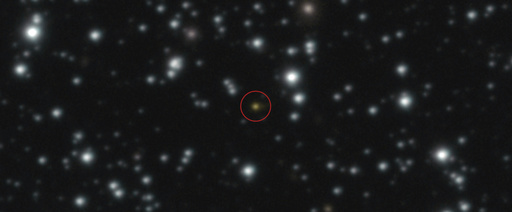 This image provided by the European Southern Observatory shows a powerful explosion, orange dot at the center of the image, that repeated several times over the course of a day, The image, taken with ESO's Very Large Telescope (VLT), allowed astronomers to determine that the explosion didn't take place in the Milky Way but in another galaxy. (European Southern Observatory via AP)