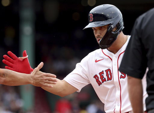 Boston Red Sox's Carlos Narváez os congratulated after hitting a two-RBI single during the fifth inning of a baseball game against the Cleveland Guardians, Monday, Sept. 1, 2025, in Boston. (AP Photo/Mark Stockwell)