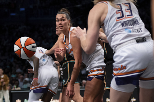 Phoenix Mercury forward Kathryn Westbeld (24) passes the ball to guard Sami Whitcomb (33) during the second half of Game 2 in the first round of the WNBA basketball playoffs against the New York Liberty, Wednesday, Sept. 17, 2025, in New York. (AP Photo/Angelina Katsanis)