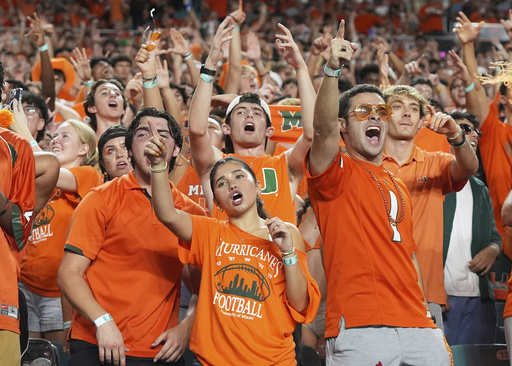 Miami fans cheer during the second half of an NCAA college football game against Notre Dame, Sunday, Aug. 31, 2025, in Miami Gardens, Fla. (AP Photo/Lynne Sladky)