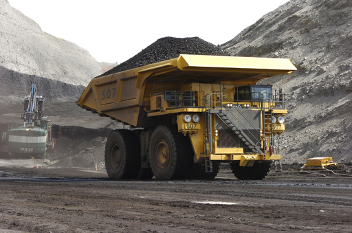 FILE - In this April 4, 2013, file photo, a mining dumper truck hauls coal at Cloud Peak Energy's Spring Creek strip mine near Decker, Mont. AP Photo/Matthew Brown, File)