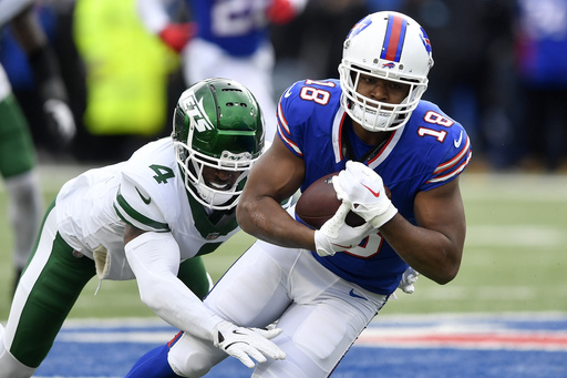 FILE - Buffalo Bills wide receiver Amari Cooper, right, is tackled by New York Jets cornerback D.J. Reed (4) during the first half of an NFL football game in Orchard Park, N.Y., Sunday, Dec. 29, 2024. (AP Photo/Adrian Kraus,File)