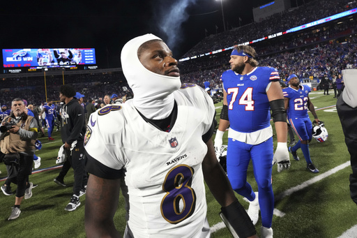 Baltimore Ravens quarterback Lamar Jackson (8) walks off the field after the team's loss to the Buffalo Bills in an NFL football game in Orchard Park, N.Y., Sunday, Sept. 7, 2025. (AP Photo/Gene J. Puskar)