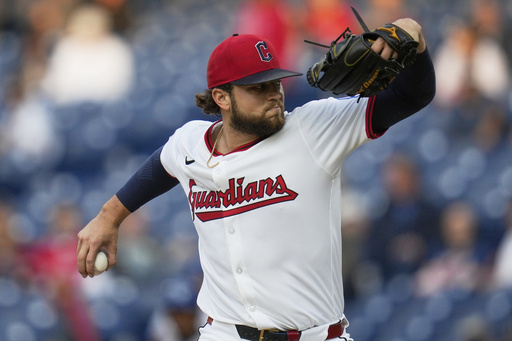 Cleveland Guardians' Slade Cecconi pitches in the first inning of a baseball game against the Kansas City Royals in Cleveland, Monday, Sept. 8, 2025. (AP Photo/Sue Ogrocki)
