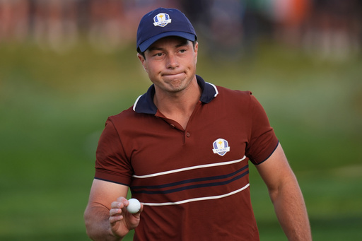 Europe's Viktor Hovland waves after making a putt on the second hole at Bethpage Black golf course during the Ryder Cup golf tournament, Saturday, Sept. 27, 2025, in Farmingdale, N.Y. (AP Photo/Seth Wenig)