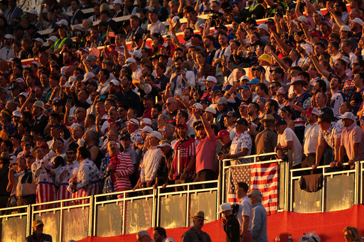Fans wait for the start on the first hole at Bethpage Black golf course during the Ryder Cup golf tournament, Friday, Sept. 26, 2025, in Farmingdale, N.Y. (AP Photo/Matt Slocum)