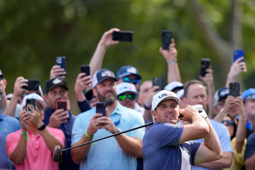 United States' Bryson DeChambeau watches his tee shot on the 12th hole during a practice round for the Ryder Cup golf tournament, Tuesday, Sept. 23, 2025, in Farmingdale, N.Y., at Bethpage State Park's Black Course. (AP Photo/Robert Bukaty)