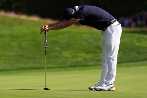 United States' Collin Morikawa reacts after missing a putt on the 13th hole at Bethpage Black golf course during the Ryder Cup golf tournament, Saturday, Sept. 27, 2025, in Farmingdale, N.Y. (AP Photo/Lindsey Wasson)