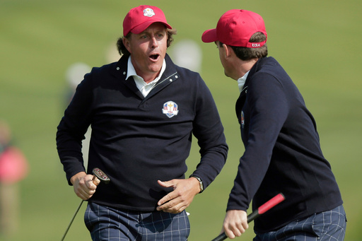 FILE - USA's Phil Mickelson, left, and Keegan Bradley celebrate after winning their foursomes match on the 15th hole at the Ryder Cup PGA golf tournament Friday, Sept. 28, 2012, at the Medinah Country Club in Medinah, Ill. (AP Photo/Charlie Riedel, File)