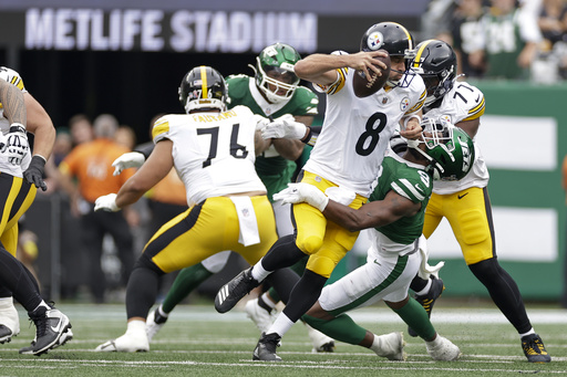 Pittsburgh Steelers quarterback Aaron Rodgers (8) is sacked by New York Jets defensive end Will McDonald IV (9) during the first half of an NFL football game Sunday, Sept. 7, 2025, in East Rutherford, N.J. (AP Photo/Adam Hunger)