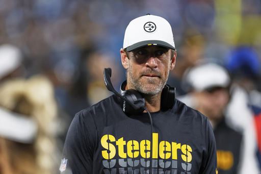 Pittsburgh Steelers quarterback Aaron Rodgers walks on the side lines during the second half of an NFL preseason football game against the Carolina Panthers, Thursday, Aug. 21, 2025, in Charlotte, N.C. (AP Photo/Rusty Jones)