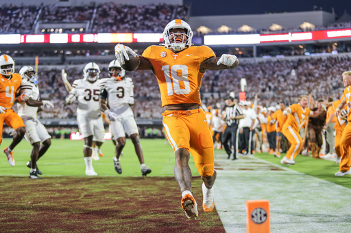Tennessee running back DeSean Bishop (18) scores the go-ahead touchdown against Mississippi State during the overtime of an NCAA college football game in Starkville, Miss., Saturday, Sept. 27, 2025. (AP Photo/James Pugh)
