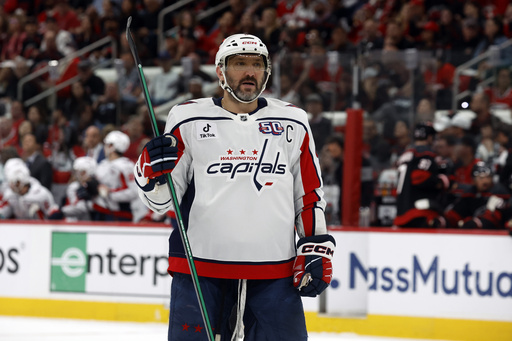 FILE - Washington Capitals' Alex Ovechkin (8) watches the puck against the Carolina Hurricanes during the first period of Game 3 of an NHL hockey Semi-final round playoff series in Raleigh, N.C., May 10, 2025. (AP Photo/Karl DeBlaker, File)