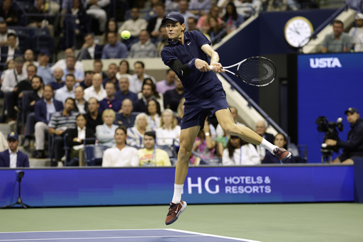 Jannik Sinner, of Italy, returns a shot to Lorenzo Musetti, of Italy, during the quarterfinal round of the U.S. Open tennis championships, Wednesday, Sept. 3, 2025, in New York. (AP Photo/Adam Hunger)