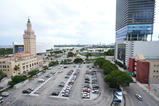 Republican Florida Gov. Ron DeSantis is proposing that President Donald Trump's presidential library be built in a parking lot that is currently used by Miami-Dade College staff and faculty and is adjacent to the Freedom Tower, Tuesday, Sept. 23, 2025, in Miami. (AP Photo/Marta Lavandier)