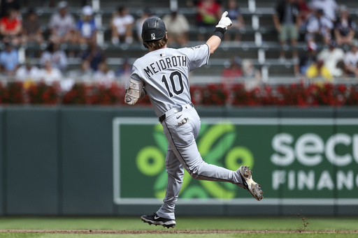 Chicago White Sox's Chase Meidroth celebrates after his two-run home run as he runs the bases during the second inning of a baseball game against the Minnesota Twins, Monday, Sept. 1, 2025, in Minneapolis. (AP Photo/Matt Krohn)