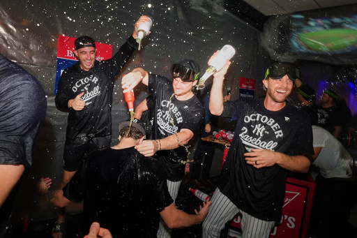 The New York Yankees celebrate after they clinched playoff berth a baseball game against the Chicago White Sox Tuesday, Sept. 23, 2025, in New York. (AP Photo/Frank Franklin II)