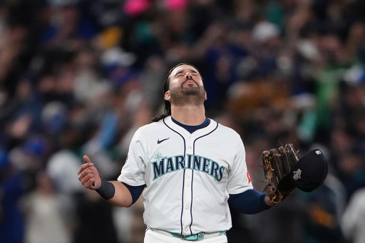 Seattle Mariners' Eugenio Suárez reacts after Game 5 of baseball's American League Championship Series against the Toronto Blue Jays, Friday, Oct. 17, 2025, in Seattle. (AP Photo/Lindsey Wasson)