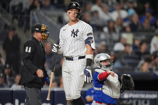 New York Yankees' Aaron Judge reacts after striking out against the Toronto Blue Jays during the eighth inning of Game 4 of baseball's American League Division Series, Wednesday, Oct. 8, 2025, in New York. (AP Photo/Frank Franklin II)