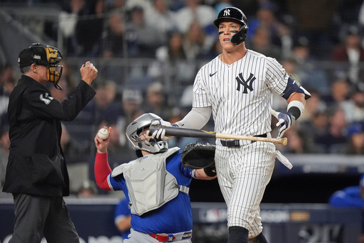 New York Yankees' Aaron Judge reacts after striking out against the Toronto Blue Jays during the eighth inning of Game 4 of baseball's American League Division Series, Wednesday, Oct. 8, 2025, in New York. (AP Photo/Frank Franklin II)