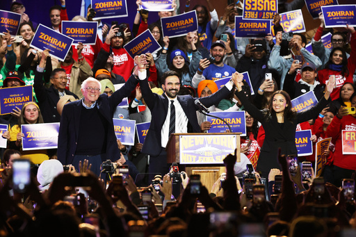 Sen. Bernie Sanders, I-Vt., left, New York City mayoral candidate Zohran Mamdani, center, and Rep. Alexandria Ocasio-Cortez, D-N.Y., appear on stage during a rally, Sunday, Oct. 26, 2025, in New York. (AP Photo/Heather Khalifa)
