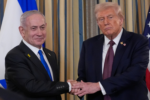 Israel's Prime Minister Benjamin Netanyahu shakes hands with President Donald Trump after a news conference in the State Dining Room of the White House, Monday, Sept. 29, 2025, in Washington. (AP Photo/Alex Brandon)
