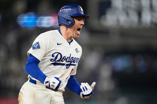 Los Angeles Dodgers' Freddie Freeman celebrates his walk off home run against the Toronto Blue Jays during the 18th inning in Game 3 of baseball's World Series, Monday, Oct. 27, 2025, in Los Angeles.(AP Photo/Brynn Anderson)