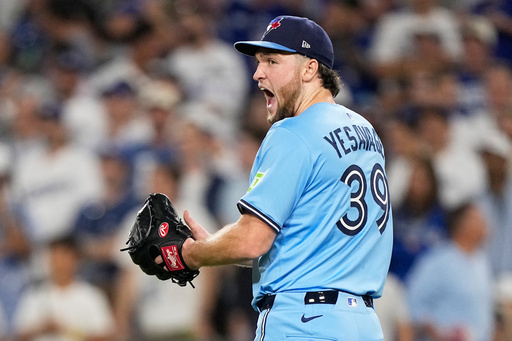 Toronto Blue Jays pitcher Trey Yesavage celebrates the end on the seventh inning in Game 5 of baseball's World Series against the Los Angeles Dodgers, Wednesday, Oct. 29, 2025, in Los Angeles. (AP Photo/Brynn Anderson)
