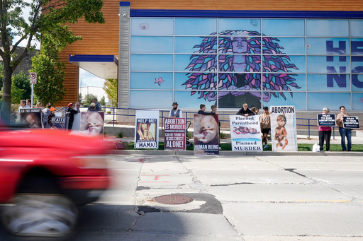 FILE - Protesters are seen outside Planned Parenthood, Sept. 18, 2023, in Milwaukee. (AP Photo/Morry Gash, File)