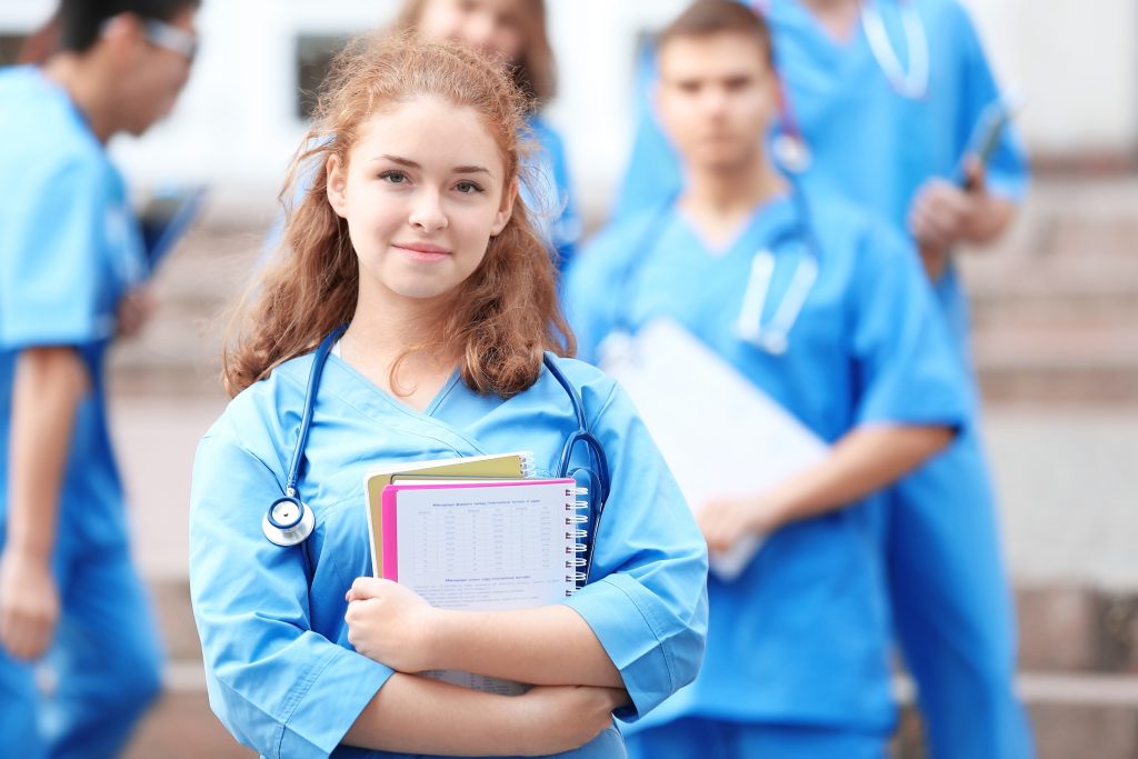 Young student with group of friends