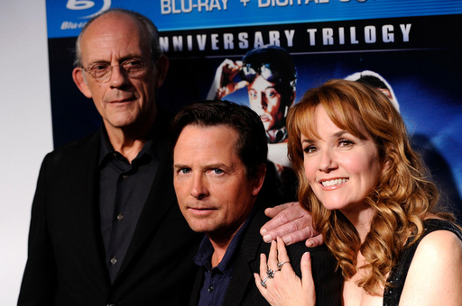 FILE - Castmembers Christopher Lloyd, from left, Michael J. Fox and Lea Thompson appear at the "Back To The Future" 25th anniversary reunion in New York on Oct. 25, 2010. (AP Photo/Peter Kramer, File)