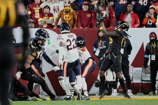 FILE - Washington Commanders wide receiver Noah Brown (85) catches a 52-yard touchdown pass in the end zone as time expires to give the Commanders an 18-15 win over the Chicago Bears in an NFL football game, Oct. 27, 2024, in Landover, Md. (AP Photo/Nick Wass, File)