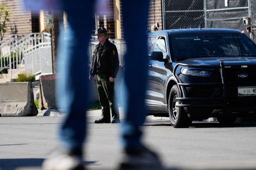 A Illinois State Police officer stands outside an ICE (U.S. Immigration and Customs Enforcement) processing facility in the Chicago suburb of Broadview, Ill., Tuesday, Oct. 21, 2025. (AP Photo/Nam Y. Huh)