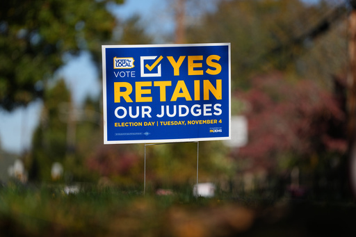 A sign is posted in support of retaining Pennsylvania Supreme Court justices in the November election, in Berwyn, Pa., Wednesday, Oct. 22, 2025. (AP Photo/Matt Rourke)