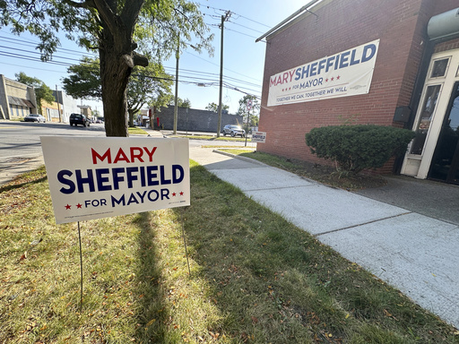 A lawn sign and banner are pictured on display outside a campaign office for Detroit mayoral candidate Mary Sheffield, Saturday, Sept. 27, 2025, on Detroit's west side. (AP Photo/Robert Yoon)