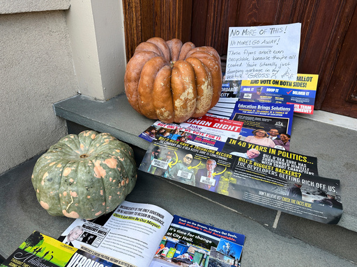 A Halloween display of unwanted campaign fliers sits in front of a private home in The Heights neighborhood of Jersey City, N.J, Thursday, Oct. 23, 2025. (AP Photo/Robert Yoon)