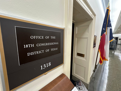 A Texas flag is on display outside the office of the state's 18th Congressional District, which has a seat that became vacant March 5, 2025, following the death of Democratic Rep. Sylvester Turner, in Washington, Sept. 2, 2025. The (AP Photo/Robert Yoon)