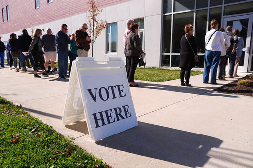 FILE - Voters wait in line to cast there ballot at a polling place at Rowan College in Mt Laurel, N.J., Oct. 27, 2025. (AP Photo/Matt Rourke, File)