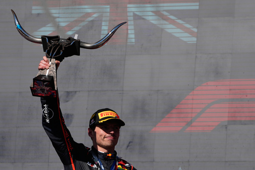 Red Bull driver Max Verstappen of the Netherlands celebrates on the podium after winning the Formula One U.S. Grand Prix auto race in Austin, Texas, Sunday, Oct. 19, 2025. (AP Photo/John Locher)