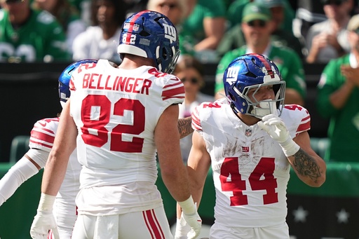 New York Giants running back Cam Skattebo celebrates a touchdown with teammates during the first half of an NFL football game against the New York Giants on Sunday, Oct. 26, 2025, in Philadelphia. (AP Photo/Matt Rourke)