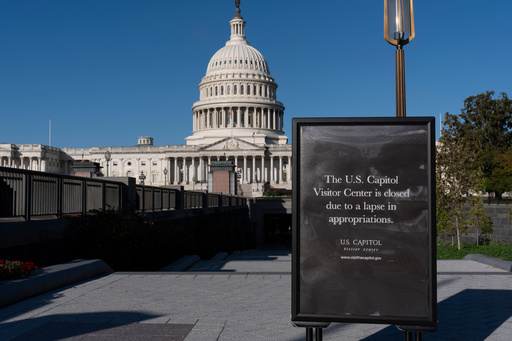 With the government shutdown now in its third week, a sign turns away tourists at the entrance to the Capitol Visitor Center, in Washington, Wednesday, Oct. 15, 2025. (AP Photo/J. Scott Applewhite)