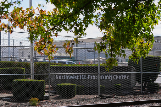 The entrance to the Northwest U.S. Immigration and Customs Enforcement Processing Center is seen, Aug. 13, 2025, in Tacoma, Wash. (AP Photo/Lindsey Wasson)