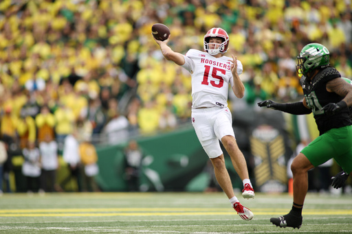 Indiana quarterback Fernando Mendoza (15) looks to throw a pass during the first half of an NCAA college football game against Oregon, Saturday, Oct. 11, 2025, in Eugene, Ore. (AP Photo/Lydia Ely)