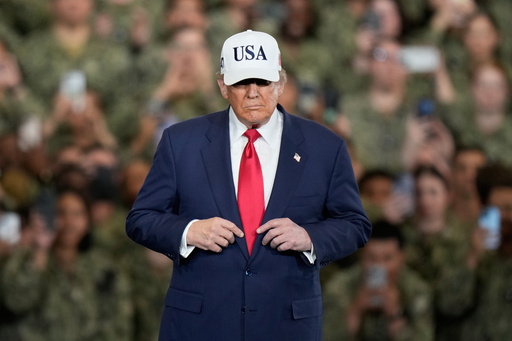 U.S. President Donald Trump arrives to meet with soldiers and servicemen at the USS George Washington at the U.S. Navy's Yokosuka base in Yokosuka, south of Tokyo, Tuesday, Oct. 28, 2025. (AP Photo/Eugene Hoshiko)