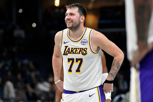 Los Angeles Lakers guard Luka Doncic (77) reacts in the second half of an NBA Cup basketball game against the Memphis Grizzlies Friday, Oct. 31, 2025, in Memphis, Tenn. (AP Photo/Brandon Dill)